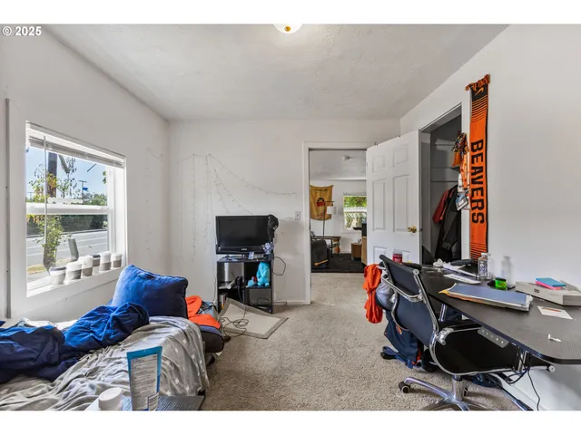 a bedroom with furniture and a window