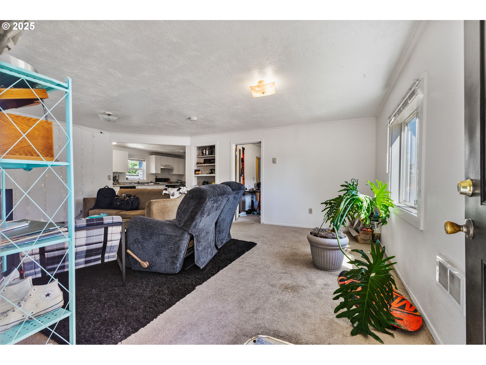 1919 Northwest Buchanan Avenue Corvallis, OR 97330 - Photo 7 of 30 a living room with furniture and a potted plant