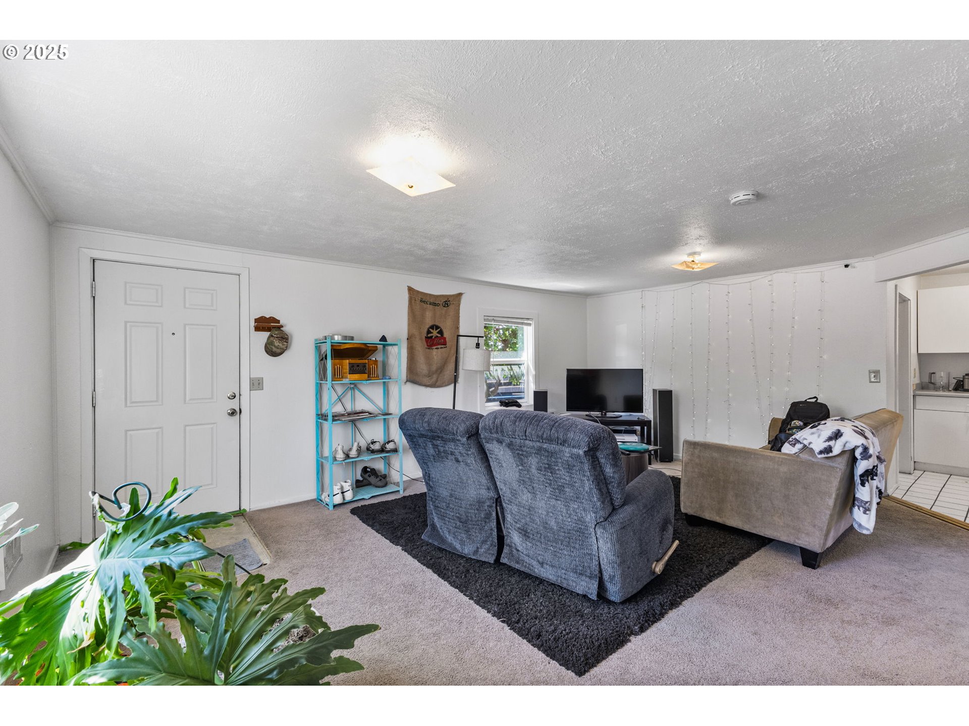 1919 Northwest Buchanan Avenue Corvallis, OR 97330 - Photo 8 of 30 a living room with furniture and a flat screen tv