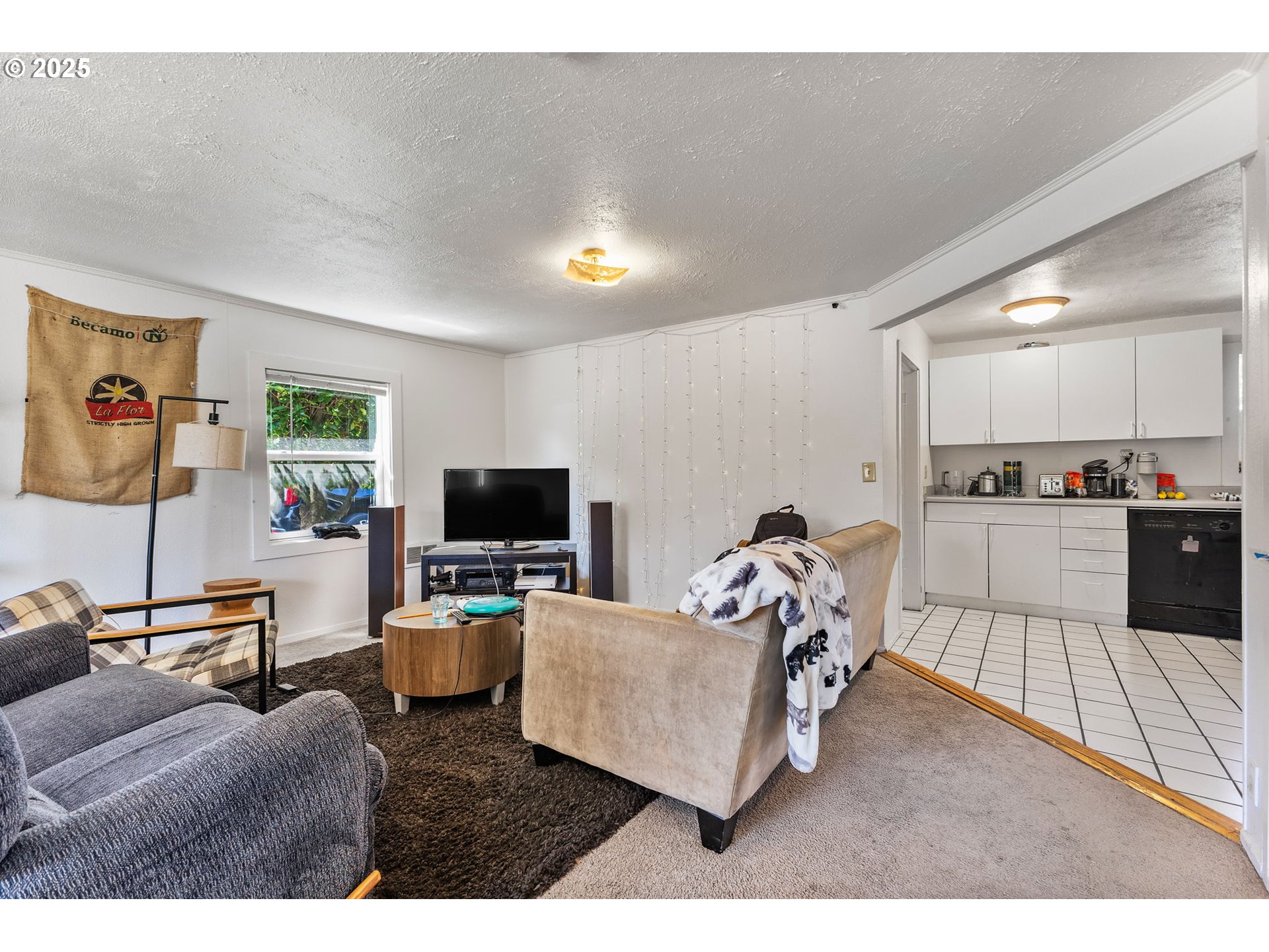 1919 Northwest Buchanan Avenue Corvallis, OR 97330 - Photo 10 of 30 a living room with furniture and a flat screen tv