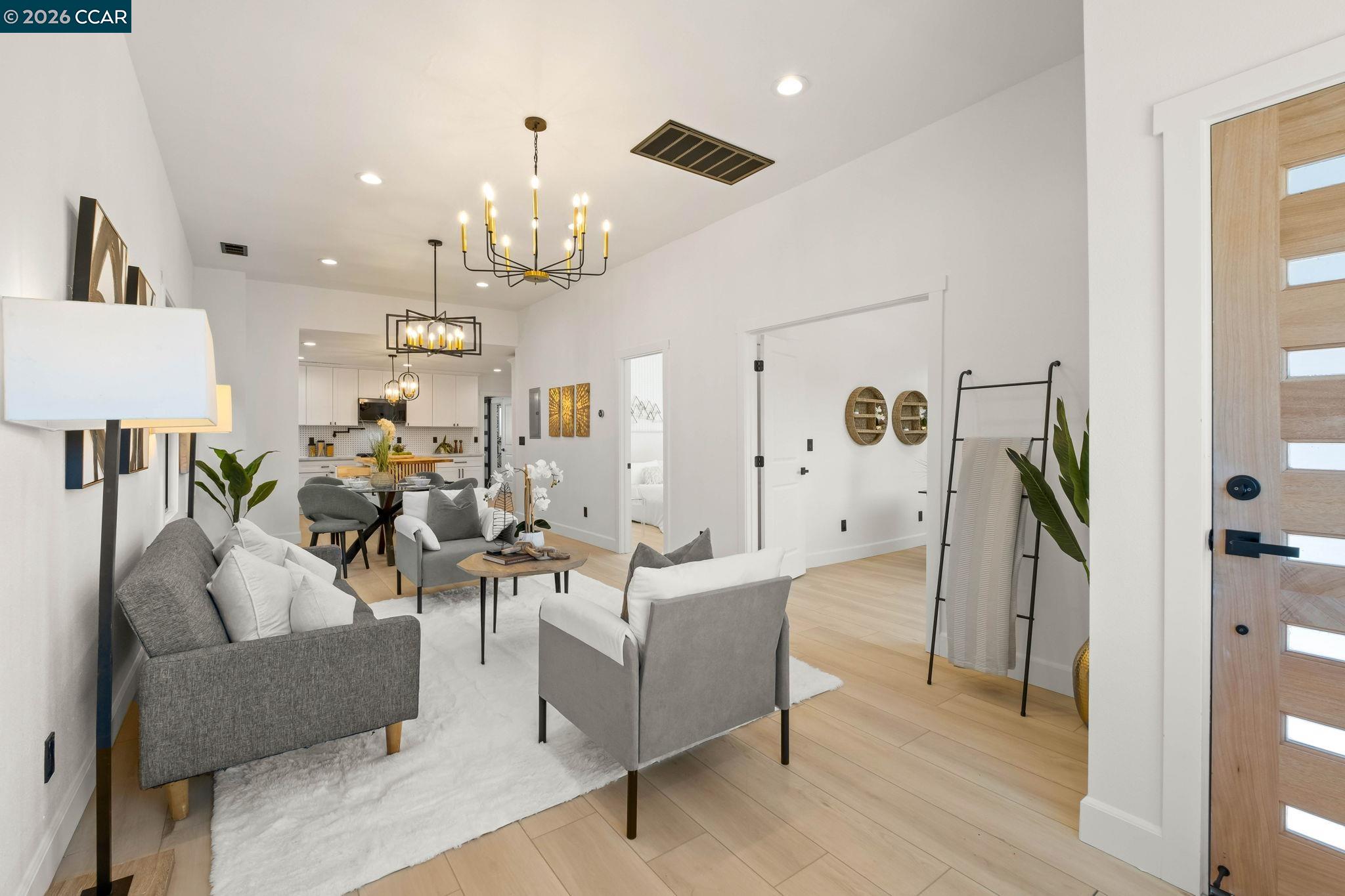 1920 Linden Street Oakland, CA 94607 - Photo 5 of 30 a living room with furniture and a chandelier