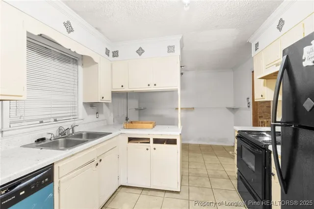 a kitchen with a sink stove and refrigerator