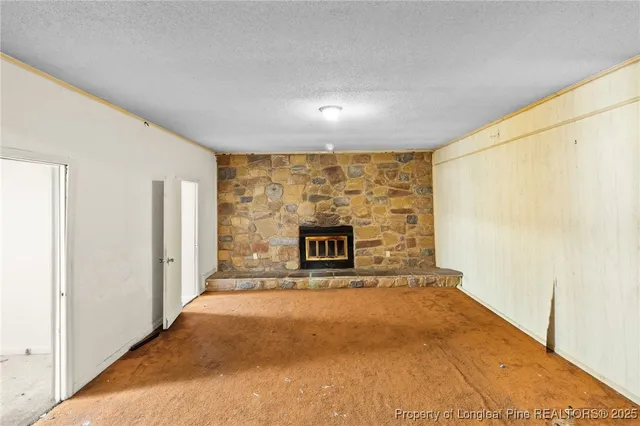 a view of a hallway with a fireplace