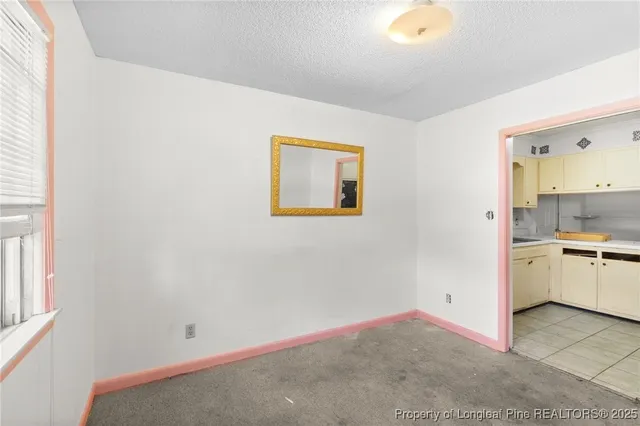 a view of a kitchen with wooden floor and a sink