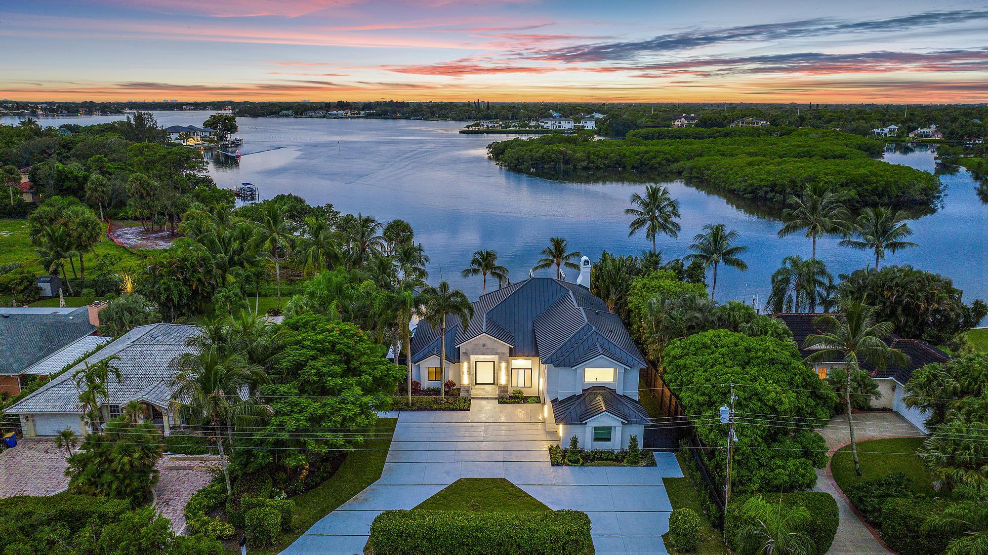 aerial view of a house with a yard