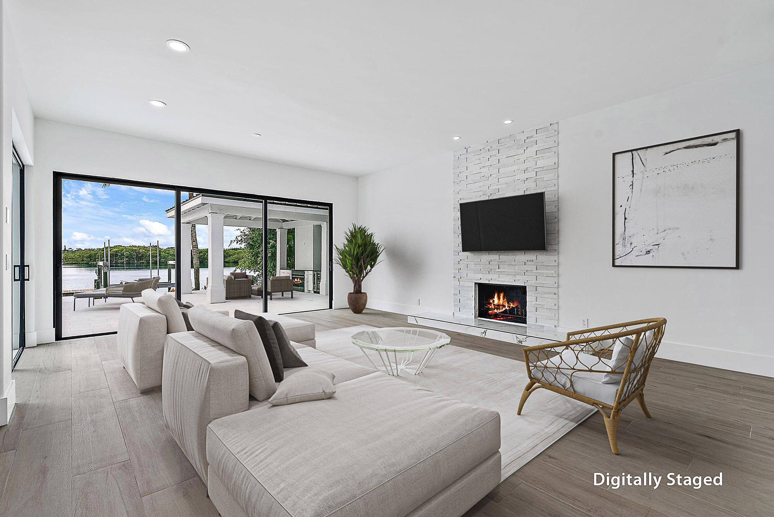 9460 Southeast Point Terrace Jupiter, FL 33469 - Photo 14 of 38 a living room with fireplace furniture and a flat screen tv