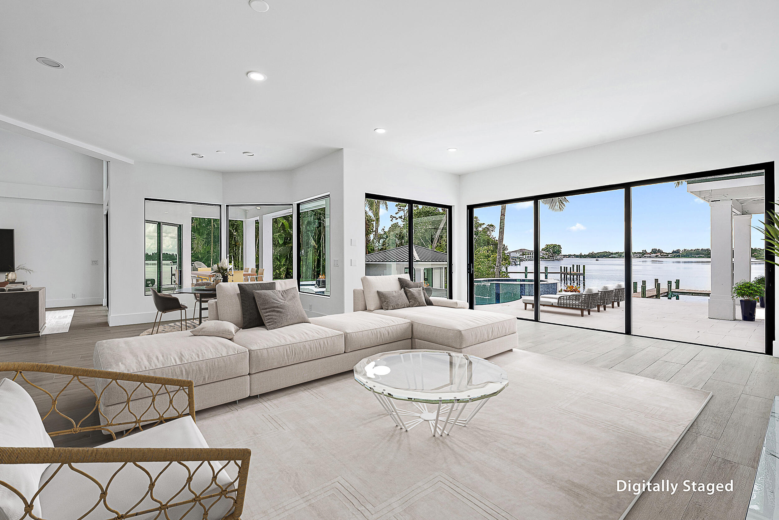 9460 Southeast Point Terrace Jupiter, FL 33469 - Photo 15 of 38 a living room with furniture and a large window with balcony view