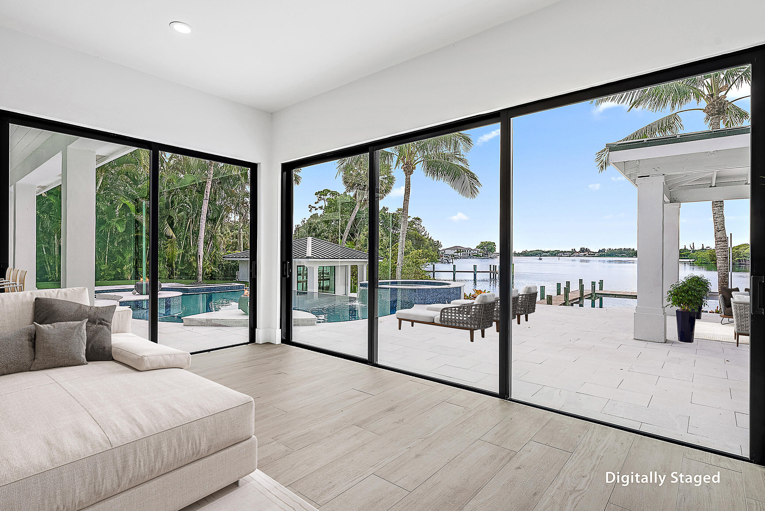 9460 Southeast Point Terrace Jupiter, FL 33469 - Photo 17 of 38 a living room with a large window and table