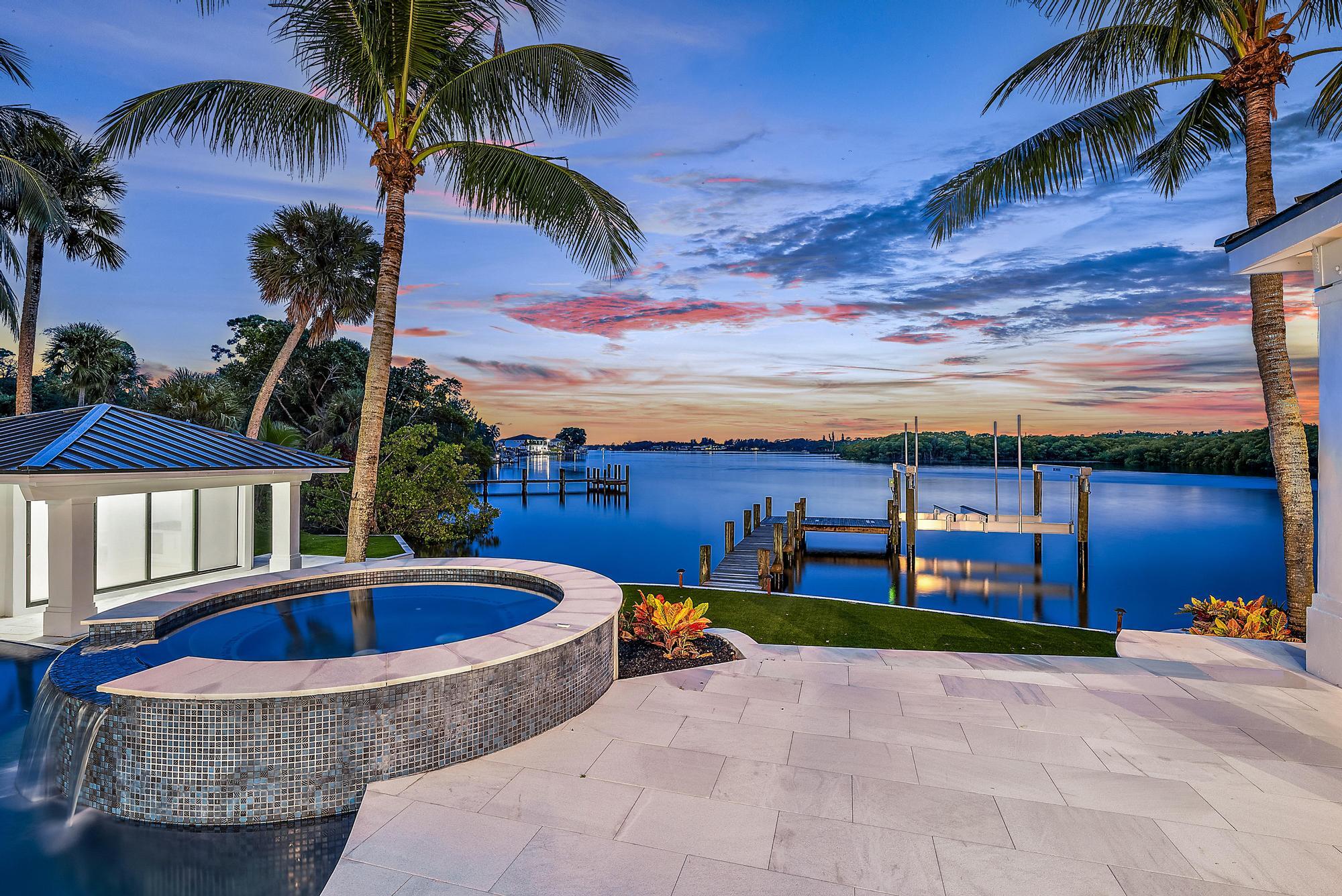 9460 Southeast Point Terrace Jupiter, FL 33469 - Photo 2 of 38 a view of outdoor space yard swimming pool and patio