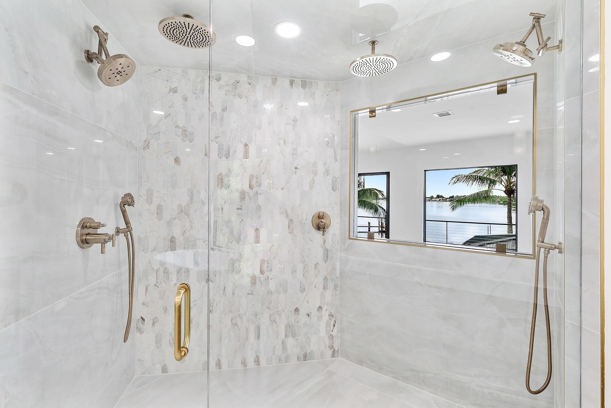 9460 Southeast Point Terrace Jupiter, FL 33469 - Photo 23 of 38 a bathroom with a shower