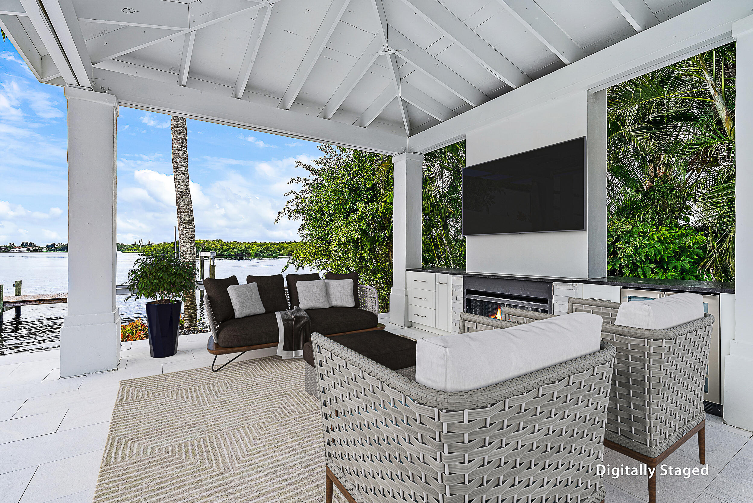 9460 Southeast Point Terrace Jupiter, FL 33469 - Photo 31 of 38 a outdoor space with the couches and a flat screen tv