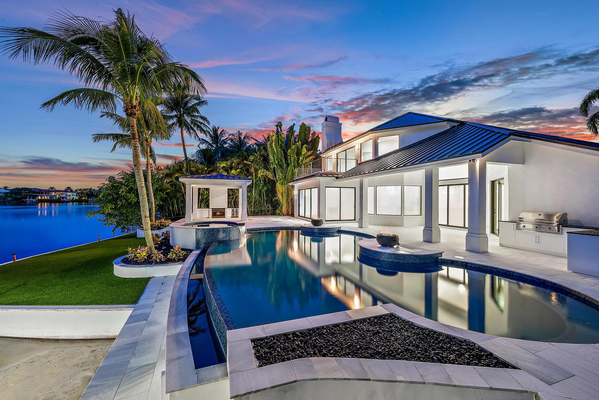 9460 Southeast Point Terrace Jupiter, FL 33469 - Photo 4 of 38 a view of a house with pool and sitting area