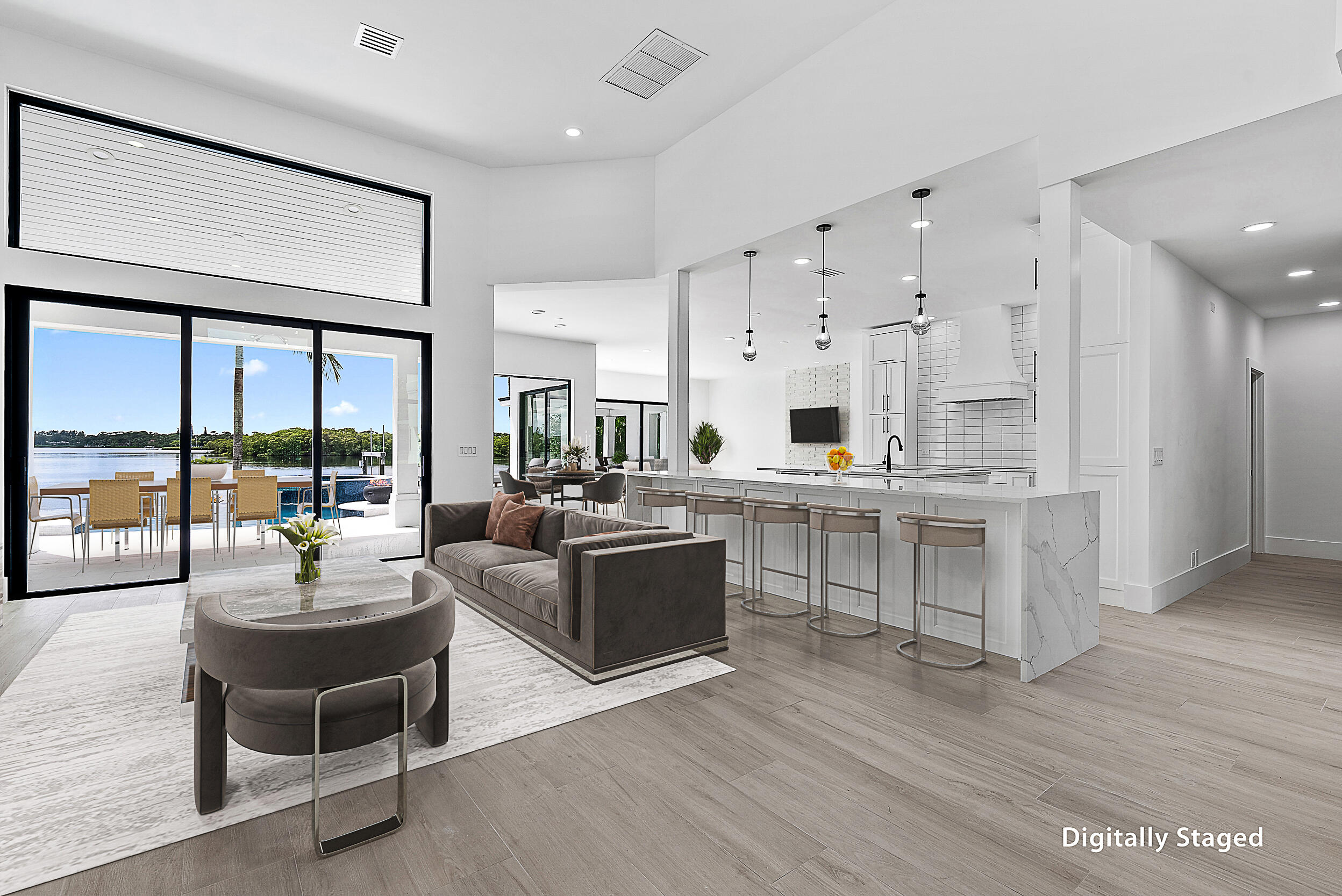 9460 Southeast Point Terrace Jupiter, FL 33469 - Photo 9 of 38 a living room with furniture wooden floor and large windows