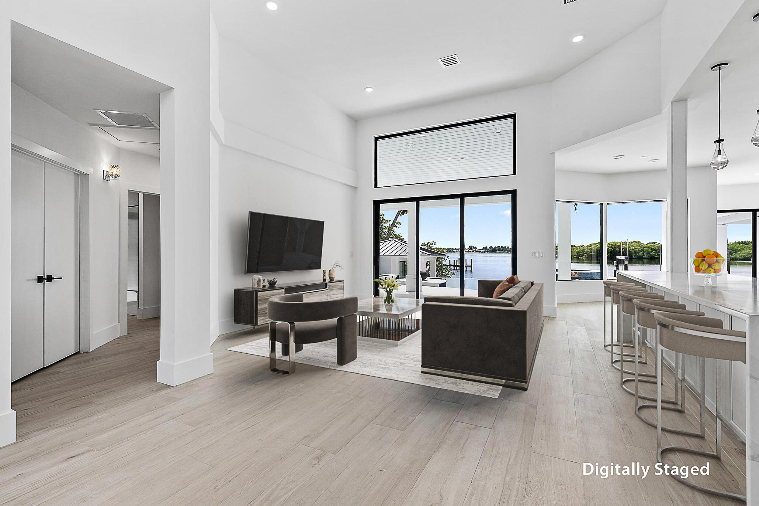 9460 Southeast Point Terrace Jupiter, FL 33469 - Photo 10 of 38 a living room with furniture and a flat screen tv