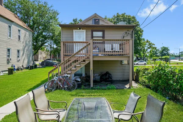 a view of a house with a yard porch and sitting area