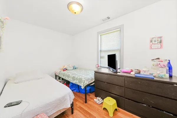 a bedroom with a bed and a couch
