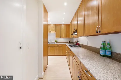 a kitchen with kitchen island granite countertop lots of counter top space