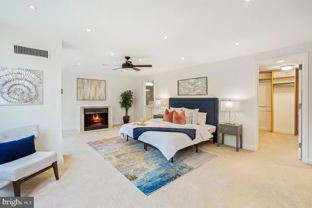 a spacious bedroom with a bed and a couch