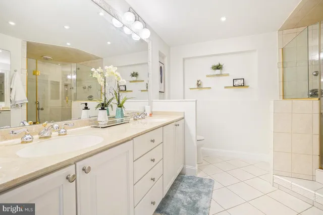 a bathroom with a double vanity sink mirror and double