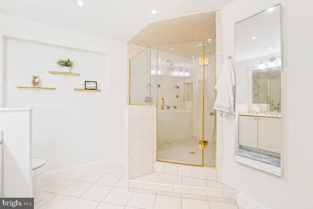 a bathroom with a glass shower door