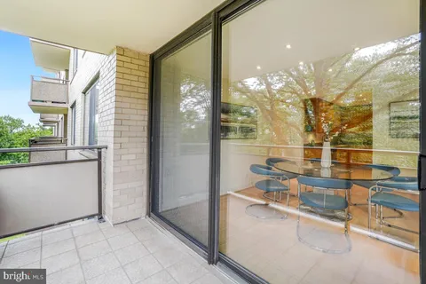 a view of a bathroom with a glass door