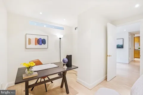 a view of a workspace with furniture