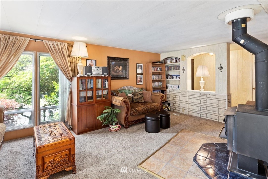 3329 206th Place Southeast Bothell, WA 98012 - Photo 7 of 29 a living room with furniture a rug and a large window