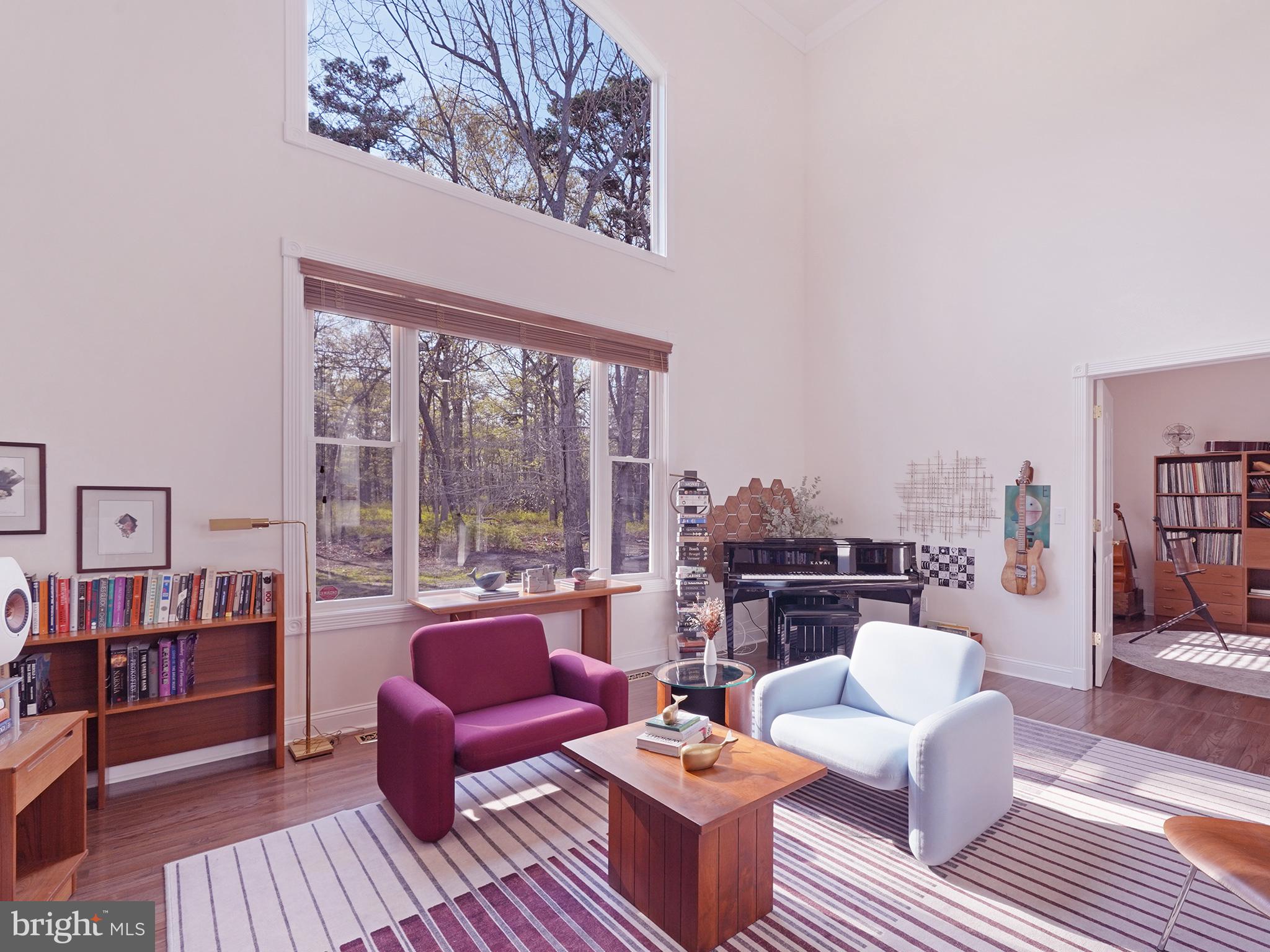 33 North New York Road Galloway Township, NJ 08205 - Photo 14 of 47 a living room with furniture and a floor to ceiling window