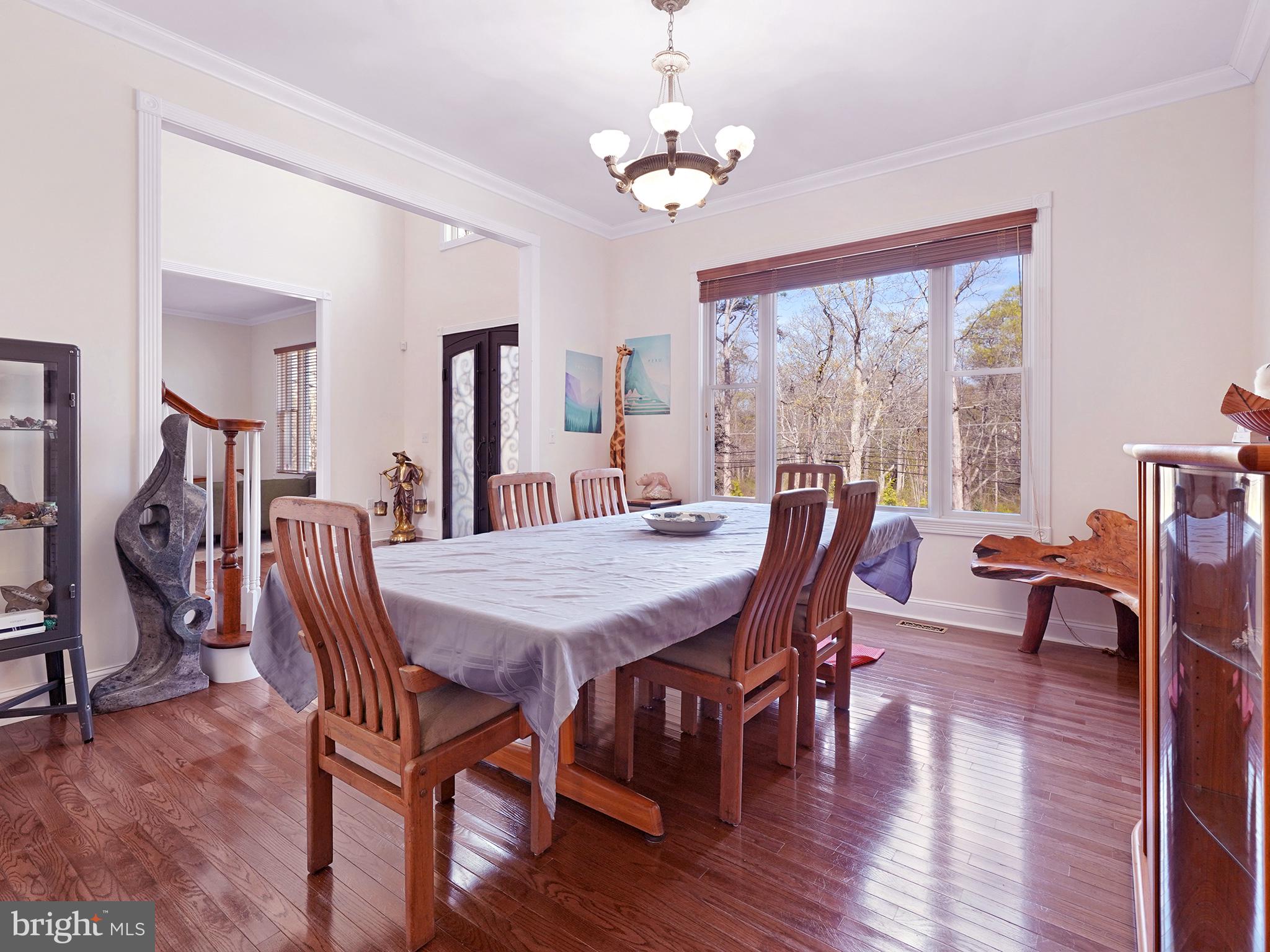 33 North New York Road Galloway Township, NJ 08205 - Photo 19 of 47 a view of a dining room with furniture window and wooden floor