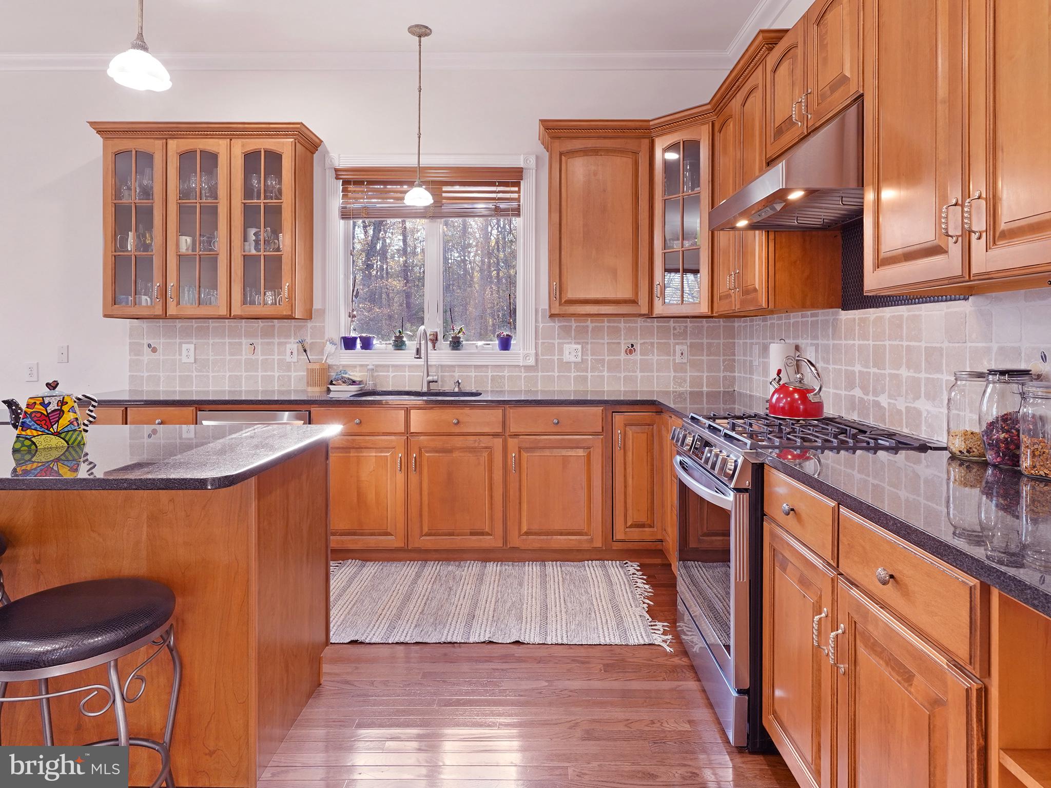 33 North New York Road Galloway Township, NJ 08205 - Photo 21 of 47 a kitchen with stainless steel appliances granite countertop a sink stove and refrigerator