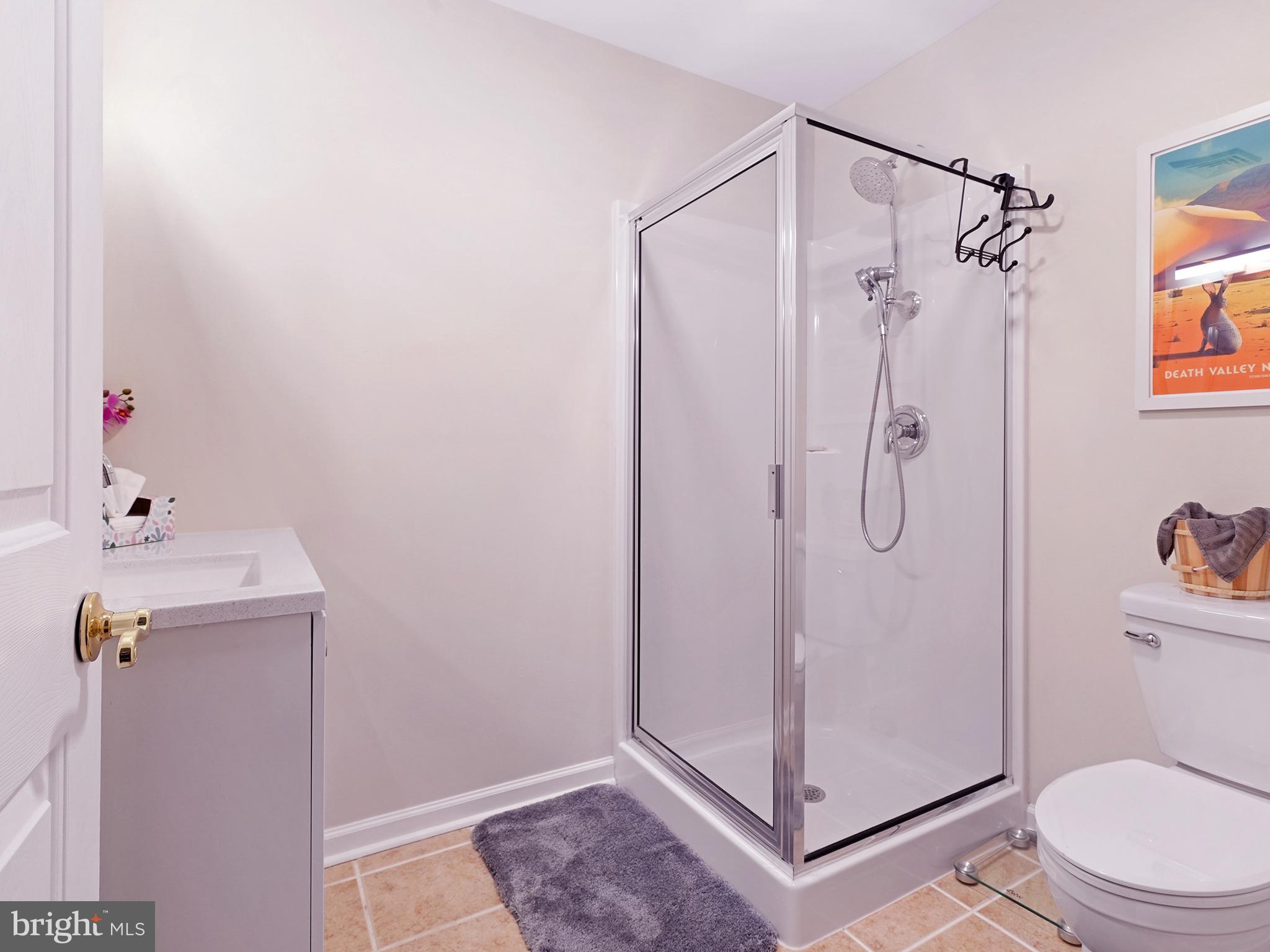 33 North New York Road Galloway Township, NJ 08205 - Photo 38 of 47 a bathroom with a shower a toilet and sink