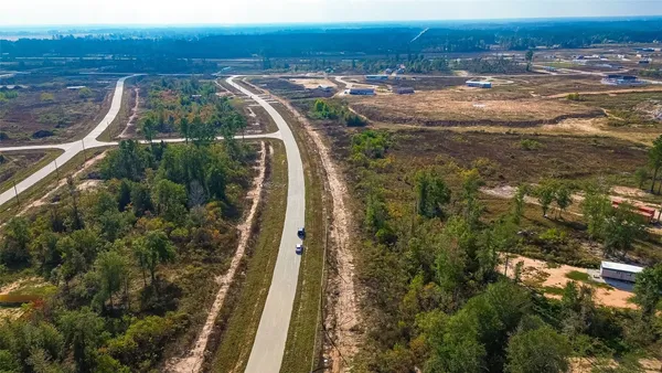 a view of a yard with an ocean view