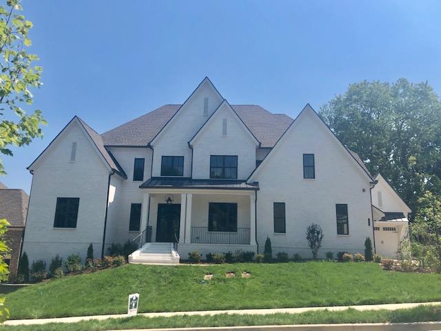 1019 Firestone Drive Franklin, TN 37067 - Photo 10 of 10 a front view of a house with a yard and trees