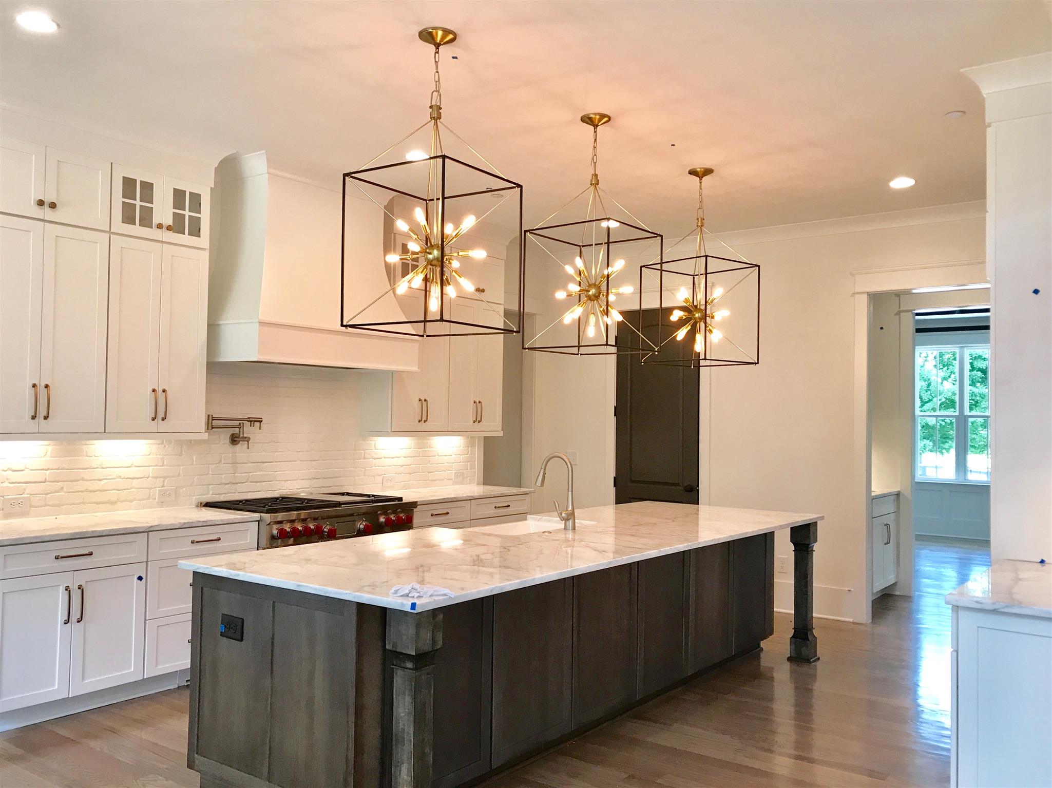 1019 Firestone Drive Franklin, TN 37067 - Photo 2 of 10 a kitchen with stainless steel appliances granite countertop a sink a counter space and cabinets