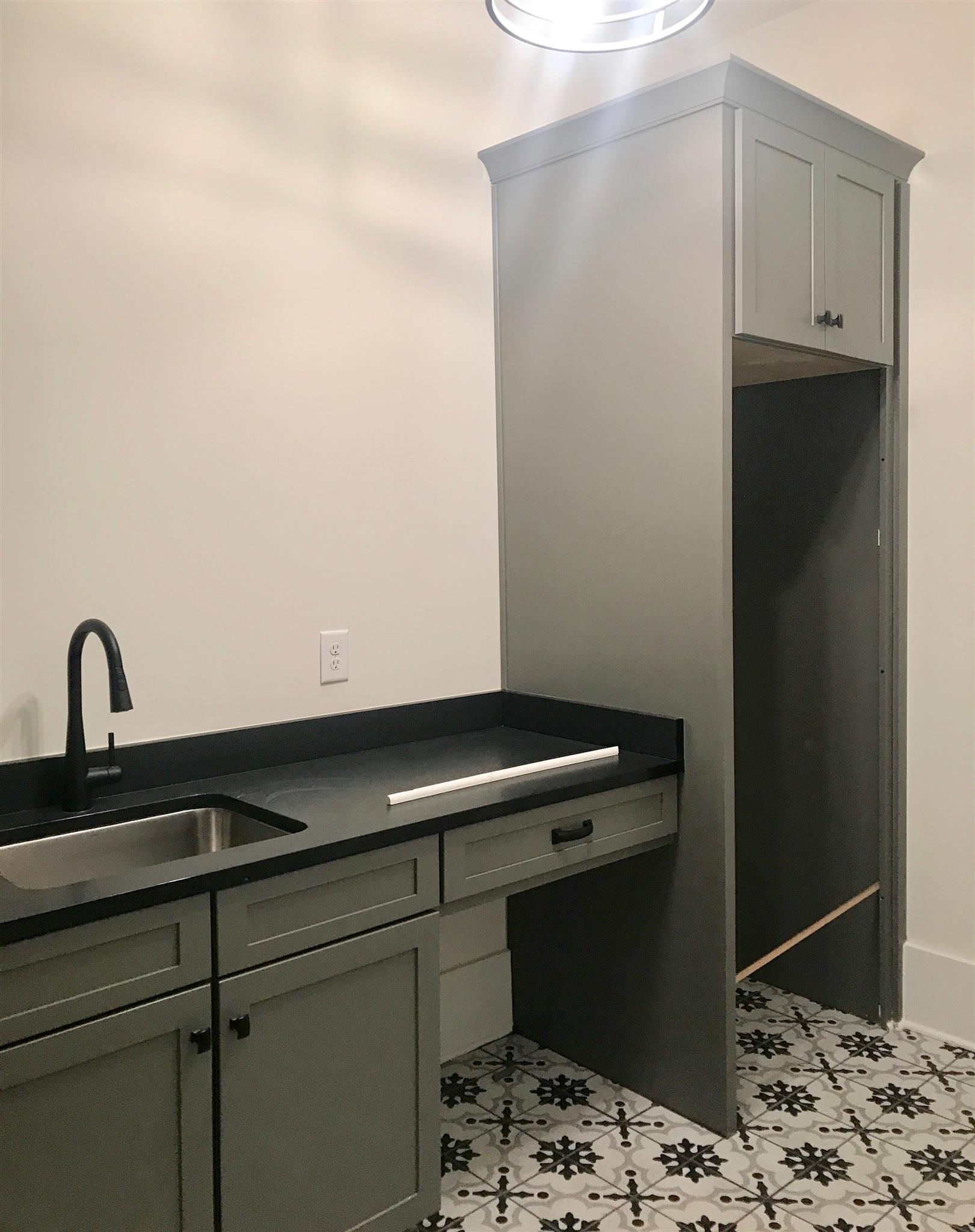 1019 Firestone Drive Franklin, TN 37067 - Photo 7 of 10 a room with cabinets and wooden floor