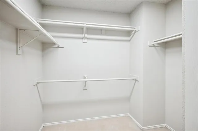 a view of an empty walk in closet
