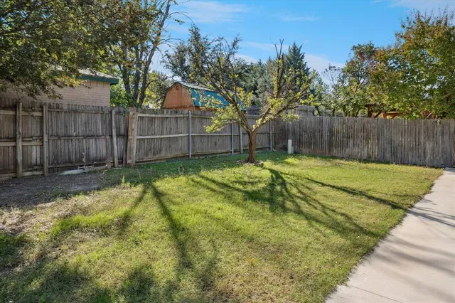 a swimming pool with wooden fence
