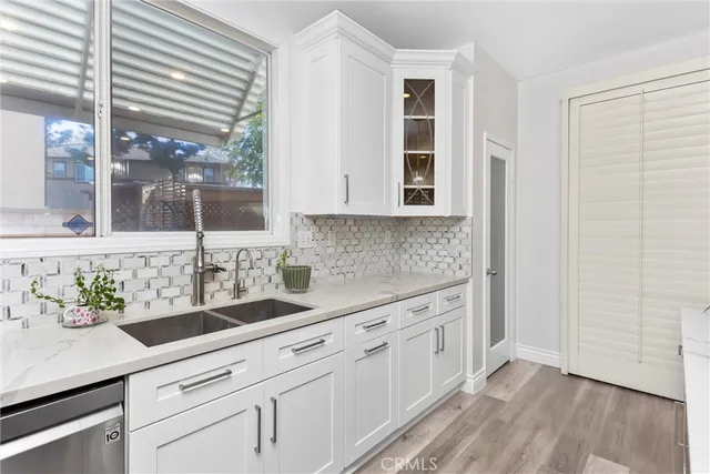 a kitchen with a sink and cabinets