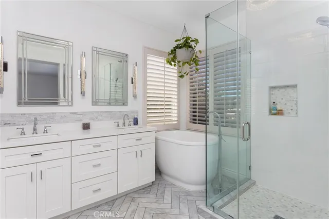 a bathroom with a sink mirror and toilet