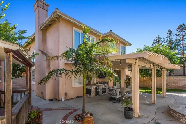 a front view of house with yard outdoor seating and barbeque oven
