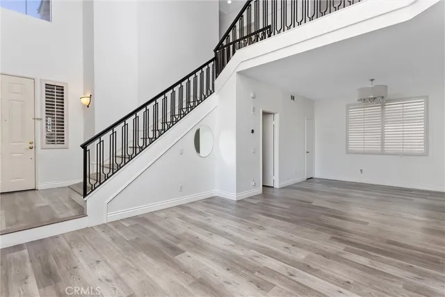a view of an entryway with wooden floor