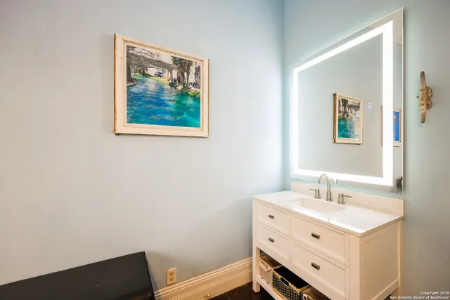 a bathroom with a sink and a mirror