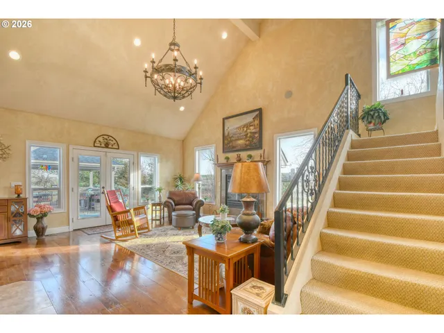 a living room with fireplace furniture and a flat screen tv