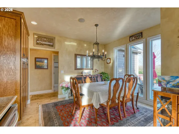 a view of a dining room with furniture and window