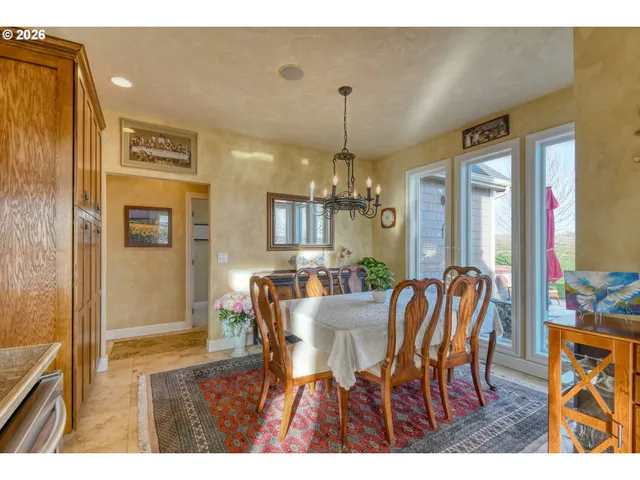 a view of a dining room with furniture and window