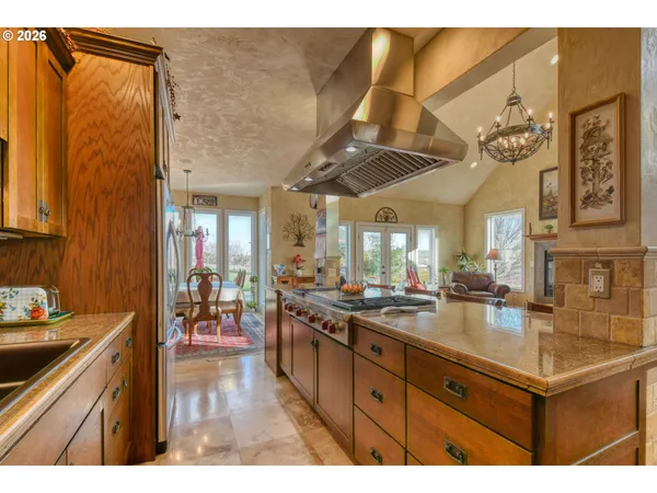 a kitchen with sink a counter and cabinets