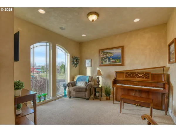 a living room with furniture and a large window