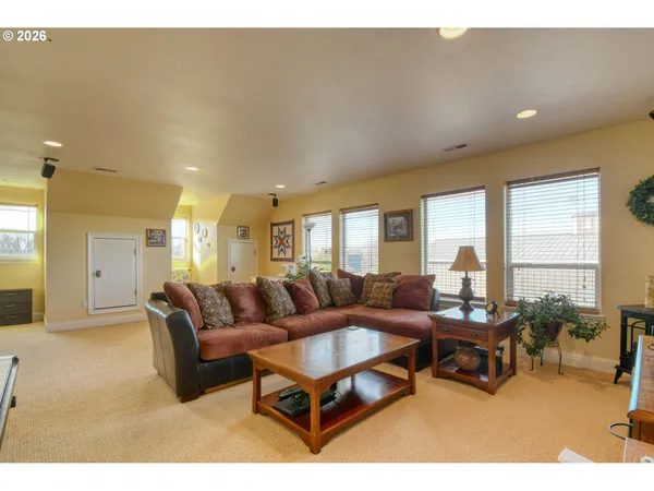 a bedroom with a bed and a couch