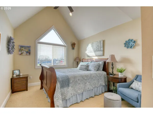 a bedroom with a large bed and a couch