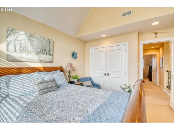 a bathroom with a granite countertop sink mirror and a toilet